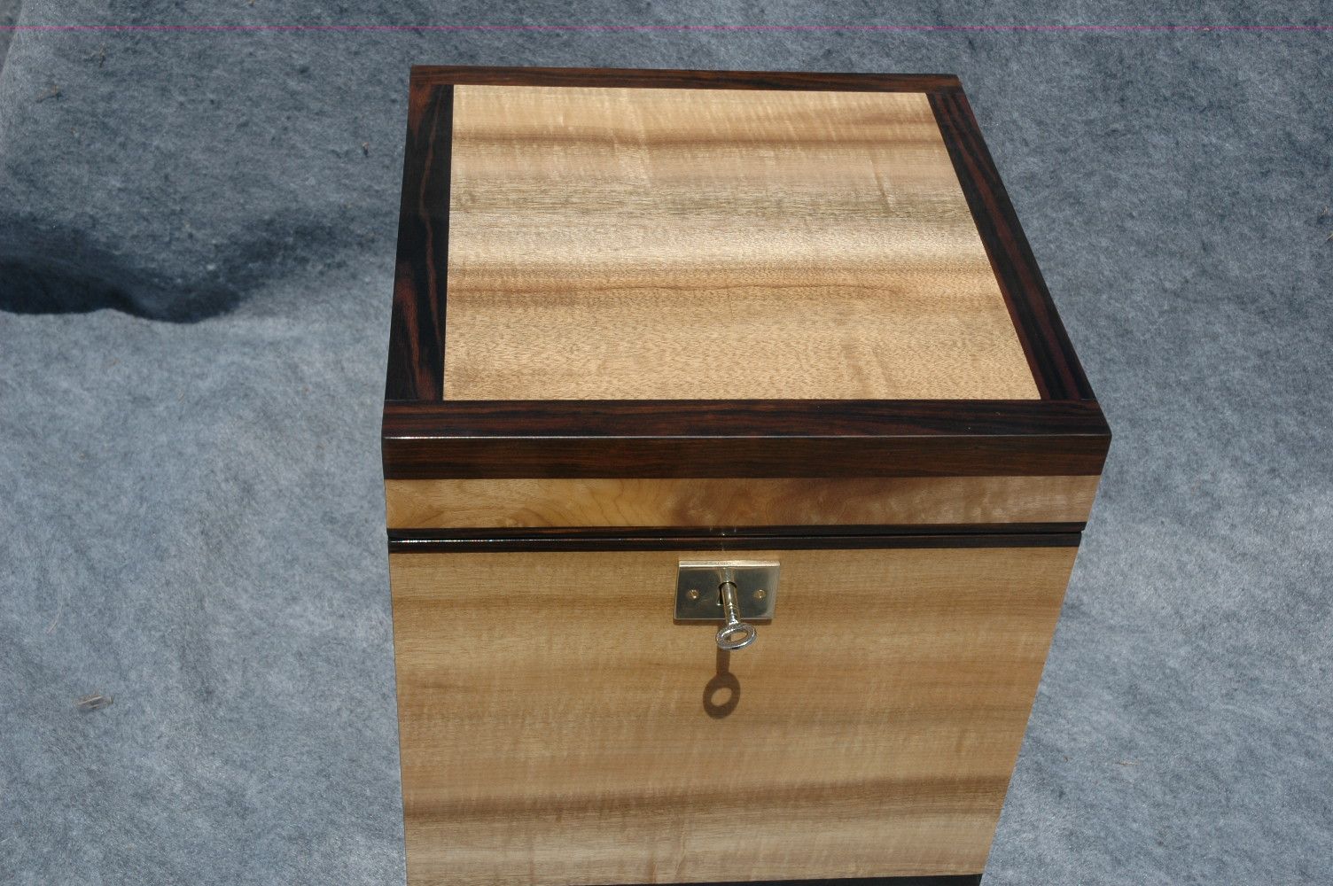 wooden urn with lock and handles