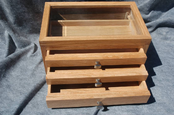 handcrafted jewelry box with three drawers all opened